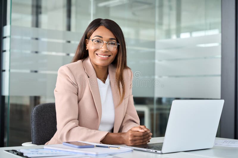 young happy professional business woman manager sits office desk portrait african american wearing suit eyeglasses working 281551939 2848922894